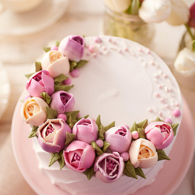 Homemade lemon cake classic recipe, decorated with sugar icing on marble  table. Healthy organic summer dessert pie with yellow tulip on background.  Stock Photo | Adobe Stock