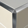 Decorative triangular tile trim aesthetically finishes the otherwise sharp tile edge of tiled coverings in kitchen