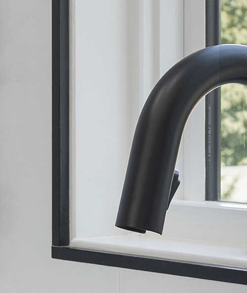 Aluminium square edge in black framing window,protects the tiles edge and allowing for a seamless transition between window and tile. Aluminium square edge in black framing window,protects the tiles edge and allowing for a seamless transition between window and tile.