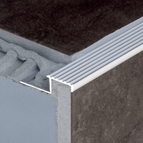 Tile-in aluminium stair nosing providing a simple, safe  and secure edge for steps covered in ceramic tiles or similar