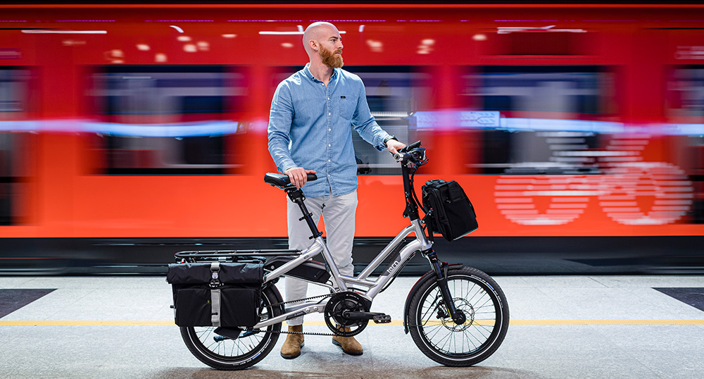 Tern HSD S+ ebike by a train