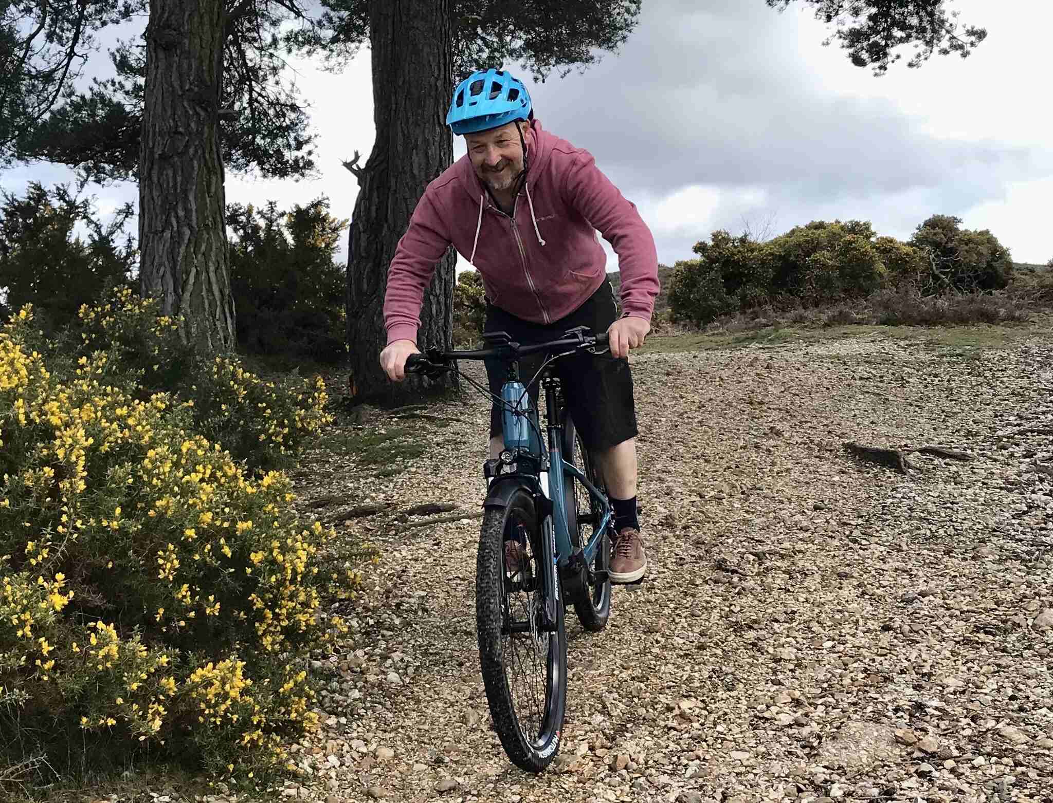 a man test riding an eMtb