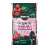 Front packaging of a bag of Miracle-Gro Organic Raised Bed & Garden Soil against a plain white background. The bag is primarily light pink with a dark green panel across the top section. The circular black "Miracle-Gro" logo sits at the center where the two colored sections meet. Below it, large dark green text reads "Organic," followed by bold maroon text reading "RAISED BED & GARDEN SOIL." The top green section features vibrant images of red vine tomatoes and a green bell pepper. The bottom section displays a red bell pepper, two small strawberries, and a garden trowel scooping up dark soil on the right. Three small feature icons are printed across the center.