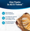 Infographic graphic with a curved dark blue header reading "One Taste Is All It Takes." On a light background, a wooden cutting board with brown butcher paper holds a sliced, grilled chicken breast in the bottom right corner. On the left, three product quality claims are listed next to light blue circular icons: "Real chicken is the #1 ingredient" with a chicken icon; "No chicken (or poultry) by-product meals, corn, wheat, or soy" with a crossed-out bone icon; and "No artificial flavors or preservatives" with a crossed-out test tube icon.
