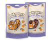 A front product photograph showcasing two varieties of Meowee! cat treat pouches standing side-by-side against a white background. On the left is a 1-ounce bag of Meowee! Savory Slices with an orange cat lying on its back, and on the right is a 1.5-ounce bag of Meowee! Snack Stacks featuring an upright orange cat. Both cream and purple pouches feature a clear, heart-shaped viewing window displaying the textured treats inside.