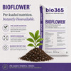 Bio365 BIOFLOWER nutrient-dense flowering soil with bioCHARGE biology, biochar, and peat-coir-perlite blend shown beside soil mix pile.