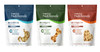 Three varieties of Fromm Family Nutritionals Functional Dog Treats in stand-up pouches lined up side-by-side against a plain white background. The selection includes the blue Digestive formula with a stomach-shaped clear window, the green Mobility formula with a bone-shaped window, and the red Immunity formula with a heart-shaped window.
