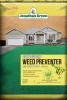 A bag of Jonathan Green Corn Gluten Weed Preventer plus Lawn Food (10-0-2) featuring a photograph of a house with a pristine green lawn and botanical weed illustrations.