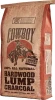 A bag of Cowboy Brand 100% All Natural Hardwood Lump Charcoal featuring a cowboy on a bucking bronco graphic.