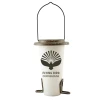 A front product photograph of a hanging wild bird feeder shaped like a coffee cup, isolated against a white background. The feeder features a tapered white body with the dark brown text "FLYING BIRD COFFEEHOUSE" beneath a bird silhouette graphic, topped with a speckled brown lid and fitted with two small matching perches at the base under a thin black wire hanging loop.