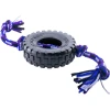 A black rubber PetSport Tire Trax tire dog toy with a blue, purple, and white braided rope strung through the center and knotted at both ends, isolated on a white background.