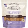 A 3 lb stand-up pouch of Wholesomes Rewards Sensitive Skin & Stomach lamb-flavored oven-baked dog treats, featuring a purple lower section and a clear window displaying the crunchy biscuits inside, isolated on a white background.