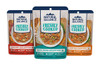 Three 9 oz pouches of Natural Balance Freshly Cooked adult dog food in Beef, Chicken, and Duck recipes, isolated on a black background.