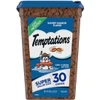 A 30 oz super value size tub of Temptations Savory Salmon Flavor cat treats with a blue lid and a label depicting a cartoon cat wearing snorkeling gear and holding a fish.
