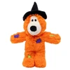 An orange plush KONG Halloween Wild Knots Witch Bear dog toy featuring a black witch hat, soft fur with purple and green patch details, a white snout, and black embroidered facial features.