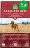 A 22 lb (9.98 kg) red bag of Open Farm Grass-Fed Beef & Ancient Grains Recipe dry dog food, featuring a brown dog standing in a field in front of a barn, with callout icons for 100% traceable ingredients, raised without antibiotics or hormones, non-GMO grains, and Certified Humane certification.