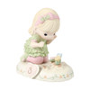 Front left angle view of Precious Moments Growing in Grace Blonde Girl with Flowers Age 3 Birthday Figurine, 142012.