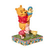 Front right view of Disney Traditions Winnie the Pooh and Piglet with Easter Chicks Statue, 6010103.