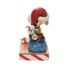 Side view of Peanuts by Jim Shore Santa Snoopy with List Figurine Statue, 6010323.