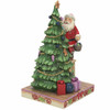 Front angle view of Heartwood Creek Santa Decorating Tree Figurine by Jim Shore, 6010819.