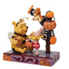 Front left angle view of the Disney Traditions by Jim Shore Winnie the Pooh & Friends Halloween Figurine, 6010864.
