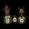 Front glow in dark view of the Disney Traditions by Jim Shore 'Cutest Pumpkins in the Patch' Mickey & Minnie Halloween Figurine, 6013052.