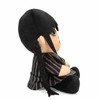 Right side view of the KidRobot Wednesday Addams 7.5in Phunny Plush Doll, KR18262.