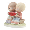 Front left angle view of the Precious Moments 'You're One In A Melon' Summer Couple with Watermelon Figurine, 213003.