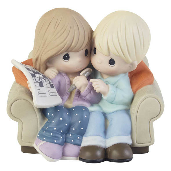 Front view of Precious Moments Crossword Couple on Sofa Figurine, 203003.