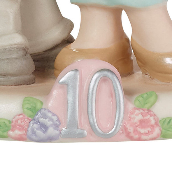 Close-up of 10 on base of the Precious Moments 'Ten Sweet Years Together' 10th Anniversary Figurine, 223016.