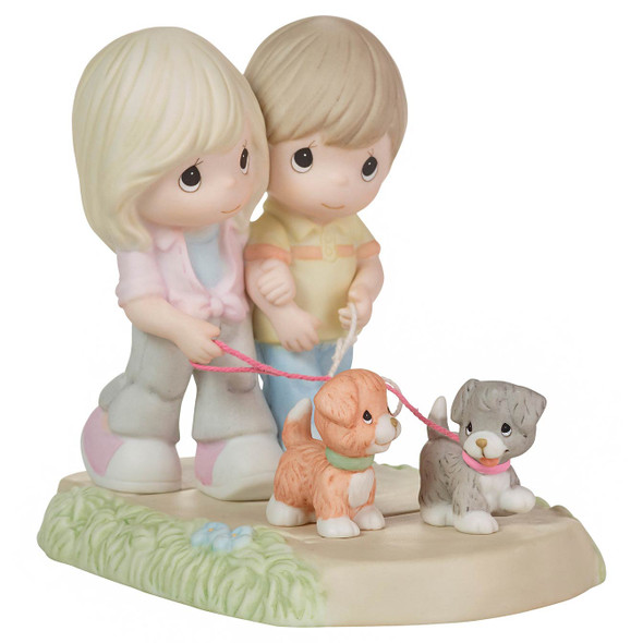 Front right angle view of the Precious Moments Couple Walking Dogs Figurine, 223003.