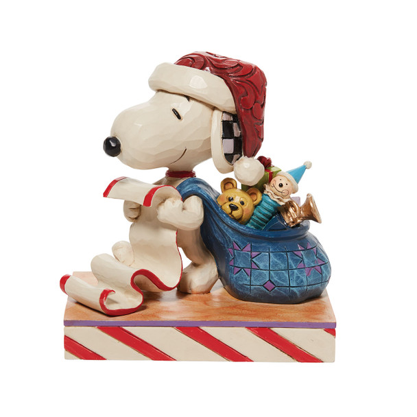 Front view of Peanuts by Jim Shore Santa Snoopy with List Figurine Statue, 6010323.