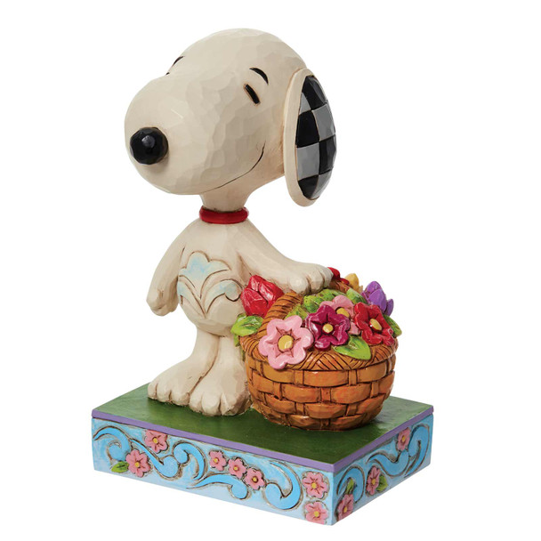 Front left angle view of the Peanuts by Jim Shore Snoopy Basket of Spring Flowers Figurine, 6011946.