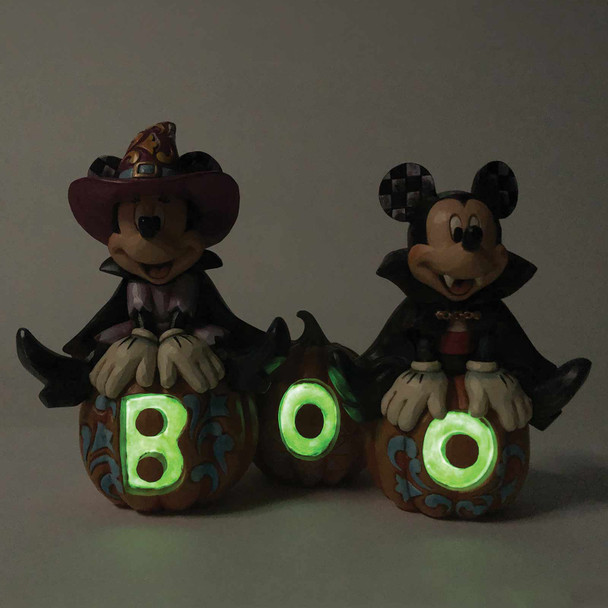 Alternate front glow in dark view of the Disney Traditions by Jim Shore 'Cutest Pumpkins in the Patch' Mickey & Minnie Halloween Figurine, 6013052. Alternate front glow in dark view of the Disney Traditions by Jim Shore 'Cutest Pumpkins in the Patch' Mickey & Minnie Halloween Figurine, 6013052.