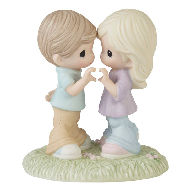 Front view of the Precious Moments Couple Hand Heart Figurine - Love Will Keep us Together, 231020.
