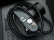 Leica ME with a black leather braided camera strap