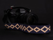 Adjustable black and blue leather camera strap on a Leica SL II