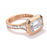 East west emerald cut ring with side baguettes in rose gold