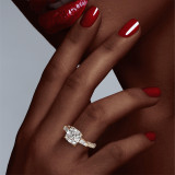 Gold Cushion Cut Baguette Engagement Ring on a Pave Band on hand