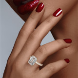 Emerald Cut Solitaire Engagement Ring on a Gold Three Phases Triple Pave Setting on hand