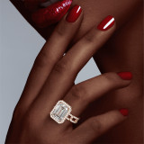 Emerald Cut Halo Engagement Ring with a Rose Gold Pave 8 Link Setting on hand