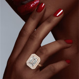 Emerald Cut Diamond Halo Ring on hand