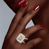 Emerald Cut Diamond Double Halo Ring on a Gold Axis Pave Setting on hand