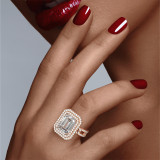 Rose Gold Emerald Cut Double Halo Engagement Ring on a Pave 8 Link Band on hand