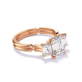 EMERALD CUT DIAMOND ENGAGEMENT RING WITH A THREE STONE CHANCE SETTING IN 18K ROSE GOLD