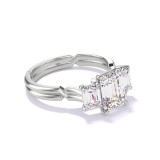 EMERALD CUT DIAMOND ENGAGEMENT RING WITH A THREE STONE CHANCE SETTING IN PLATINUM