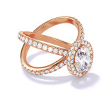 OVAL CUT DIAMOND ENGAGEMENT RING WITH A WRAPPED HALO AXIS PAVE SETTING IN 18K ROSE GOLD