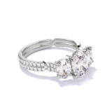 OVAL CUT DIAMOND ENGAGEMENT RING WITH A THREE STONE CHANCE PAVE SETTING IN PLATINUM