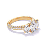 OVAL CUT DIAMOND ENGAGEMENT RING WITH A THREE STONE THREE PHASES TRIPLE PAVE SETTING IN 18K YELLOW GOLD