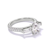 OVAL CUT DIAMOND ENGAGEMENT RING WITH A BAGUETTE FLANK THREE PHASES TRIPLE PAVE SETTING IN PLATINUM